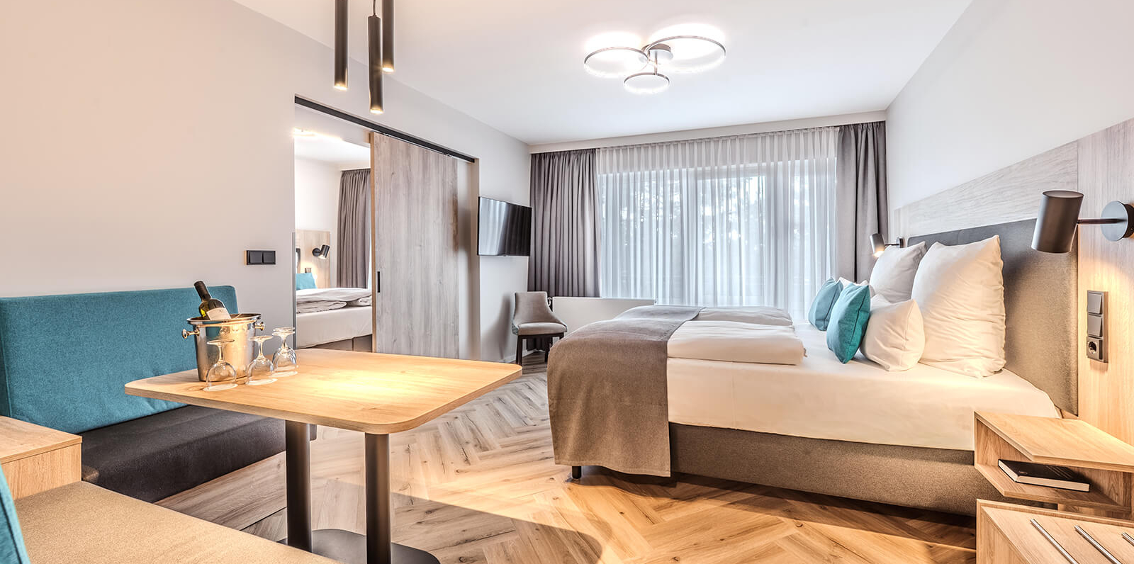 AH Deluxe Family Room with sliding doors and kitchen